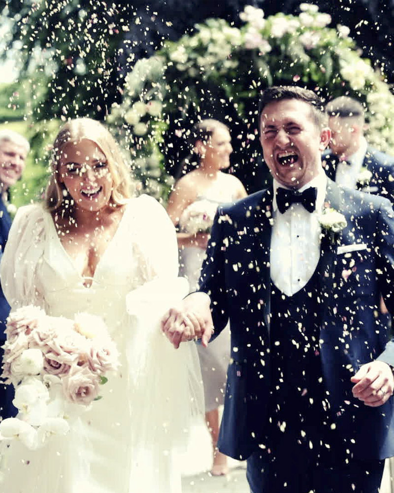 Newly Married Couple with confetti in the air at Clonwilliam House