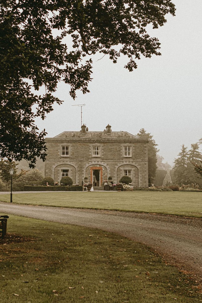 Tankardstown House and front lawn on a foggy day