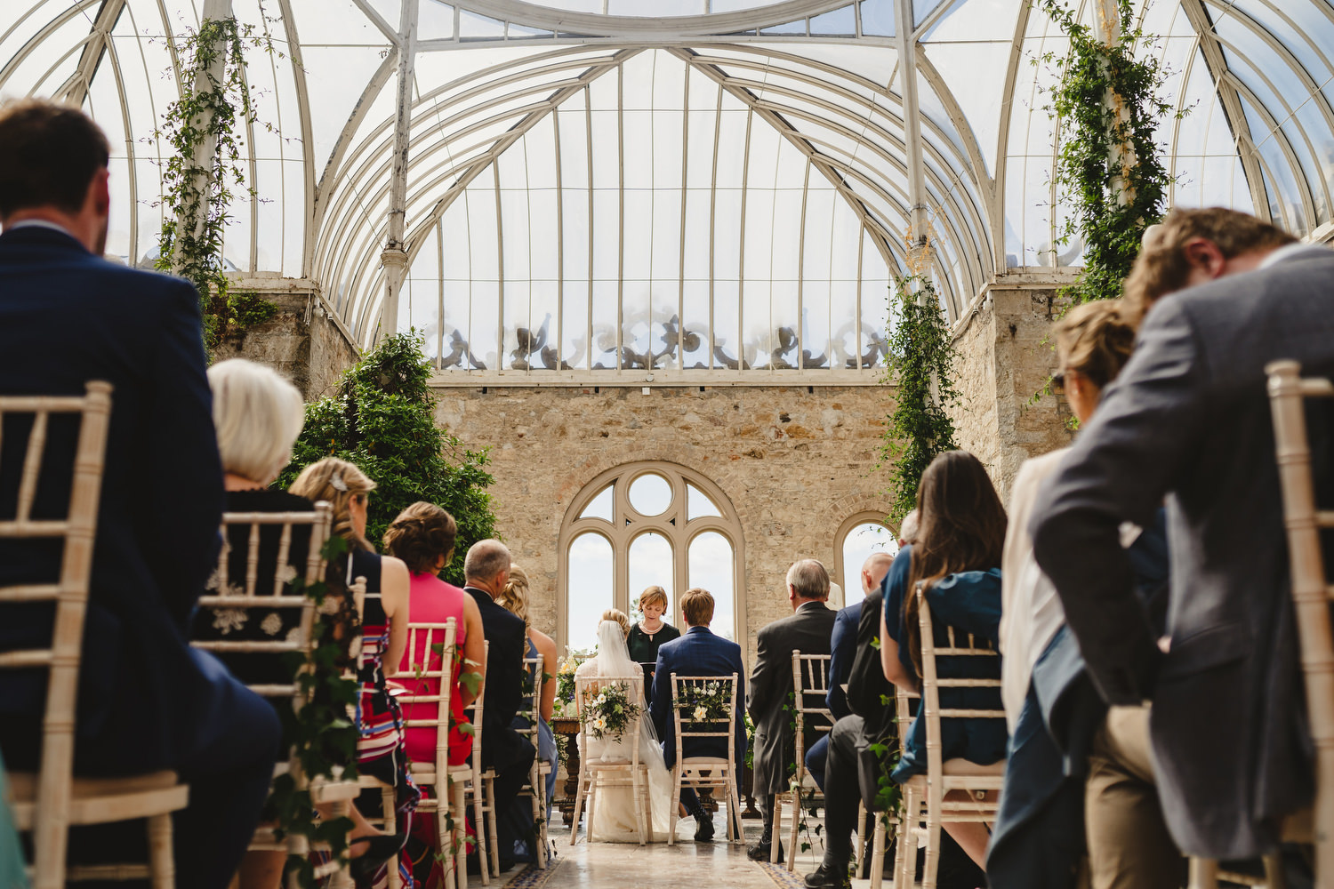 Couple and celebrant during their wedding ceremony at The Orangery at Killruddery House, Co. Wicklow