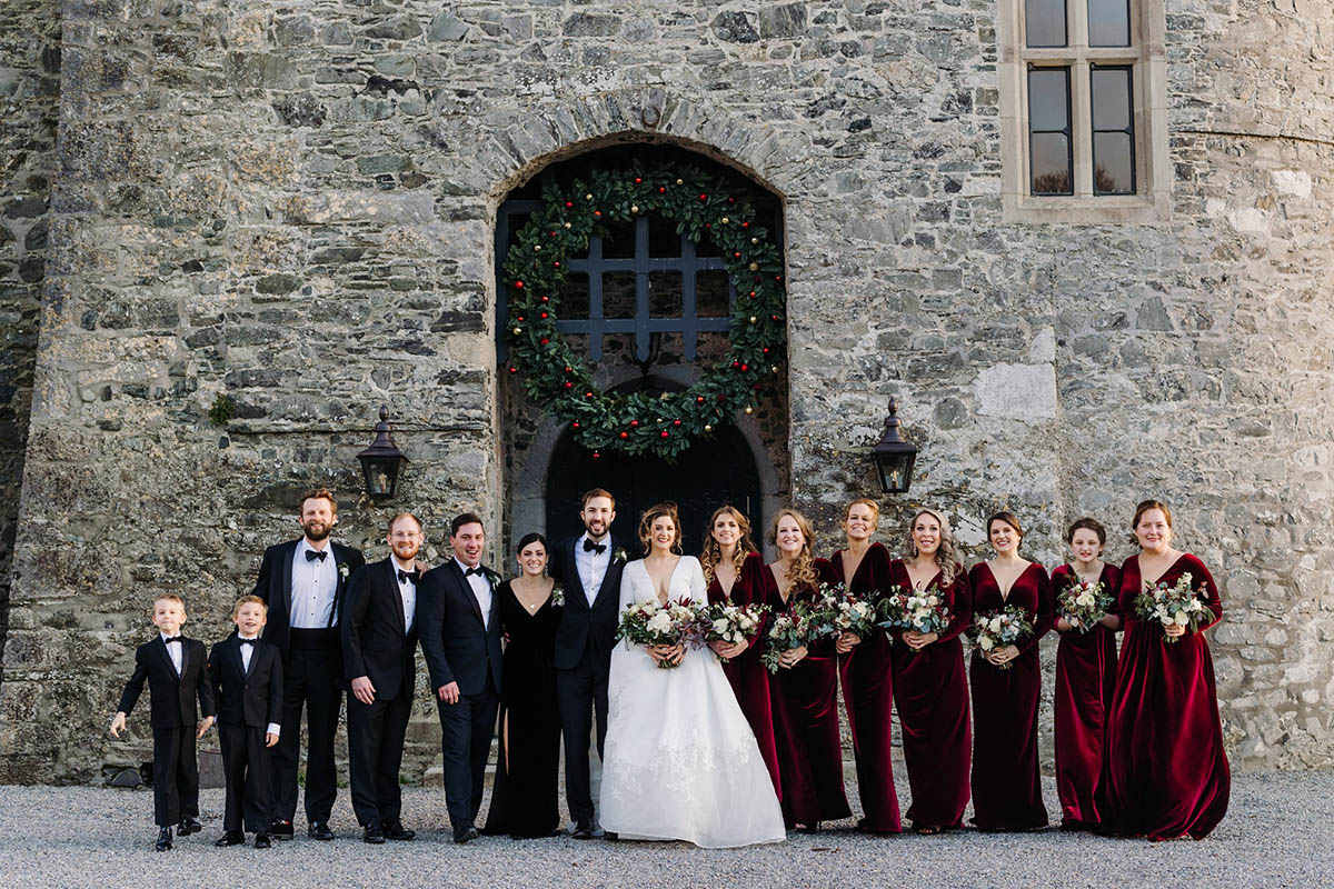 Wedding party, Bride and Groom together outside the main entrance to Kilkea Castle