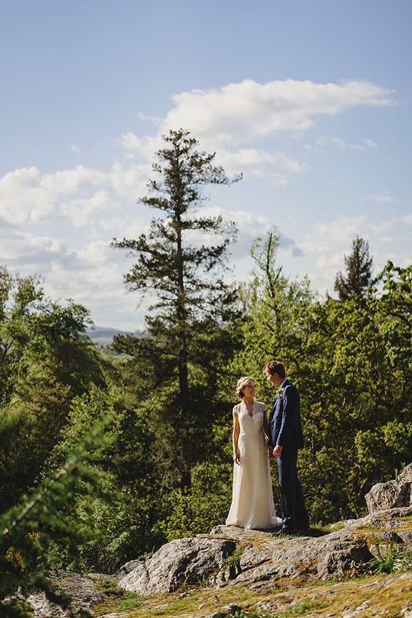 Newly married couple on their wedding day overlooking Killruddery House from a height
